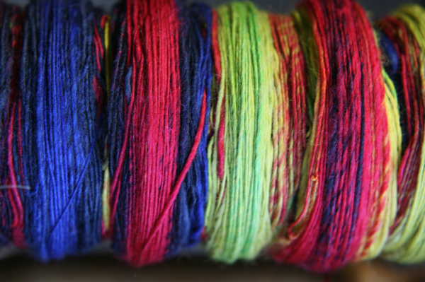 handspinning Karaoke Rainbow roving on the bobbin