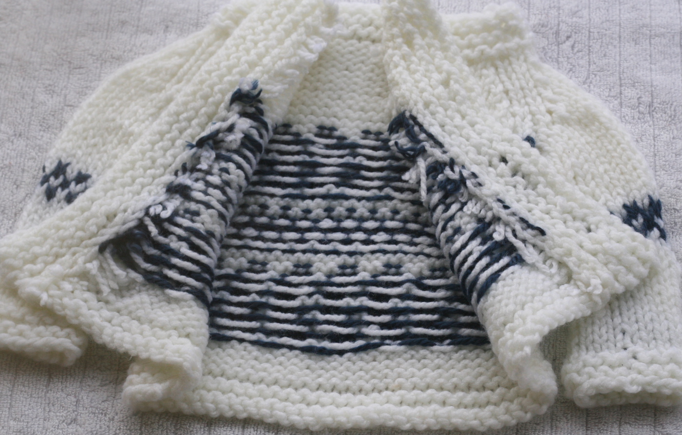 steeks on a handknit baby cardigan