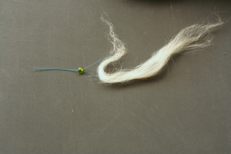 threading beads onto fiber