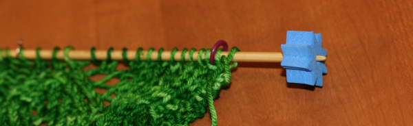 Foam bead used a a knit needle stopper